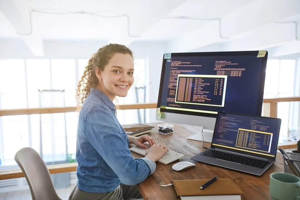 full stack developer sitting in front of her programming project