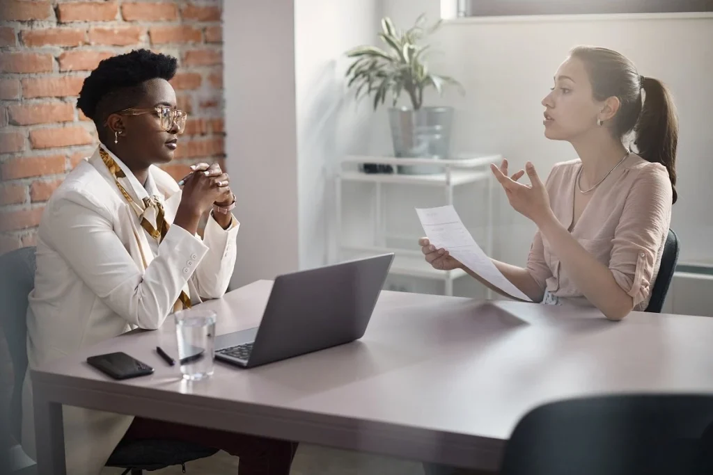 woman asking questions to ask hiring manager