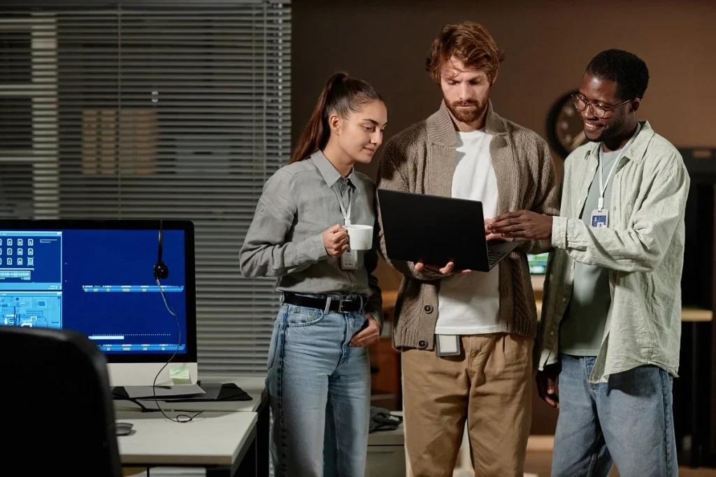 Young professionals discussing career progression in a tech office